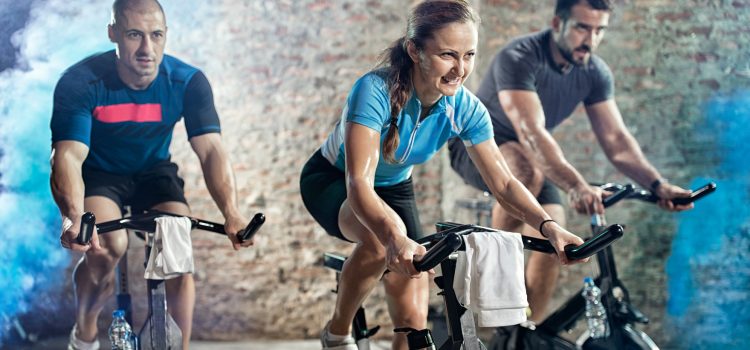 active people on cycling fitness class